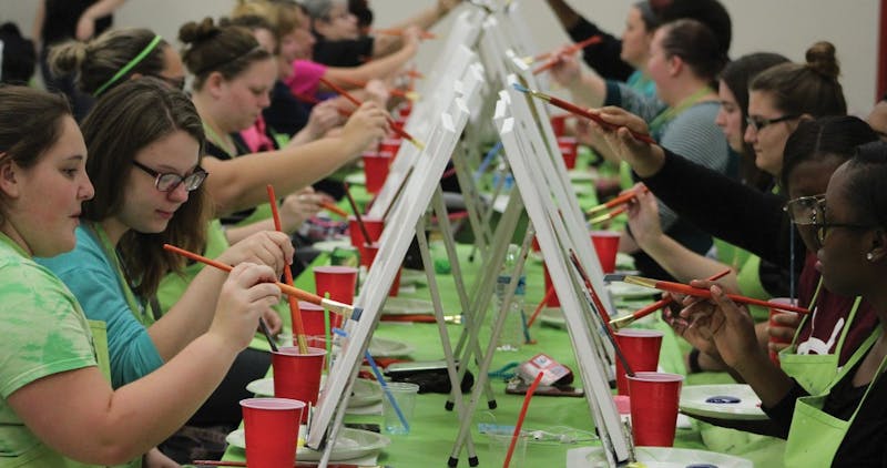 Students trying their hand at painting