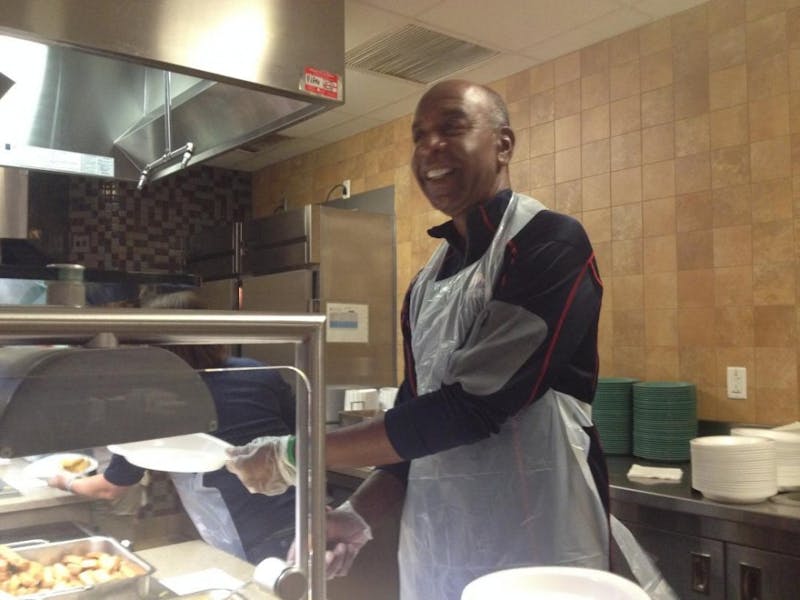 David Lovett serves eggs at Reisner for Breakfast Bingo on Aug. 22