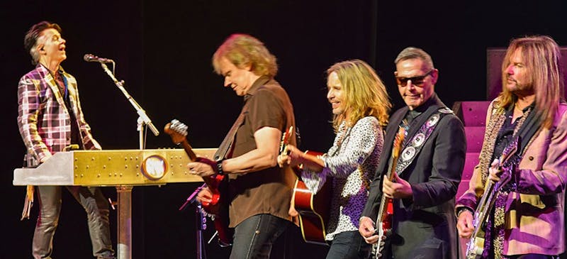 (Top) From left to right, keyboardist/vocalist Lawrence Gowan, guitarist James “J.Y.” Young, guitarist/vocalist Tommy Shaw, original bassist Chuck Panozzo and bassist Ricky Phillips come together on stage to finish their hit song “Fooling Yourself (The Angry Young Man).”&nbsp;