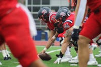 Center AJ Baldwin about to snap the ball in the 38-0 shutout loss to Shepherd on Saturday, Sept. 28.