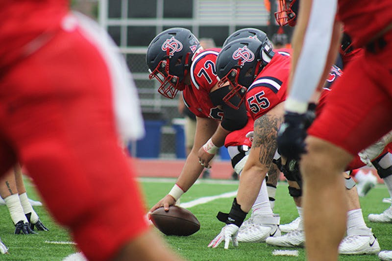 Center AJ Baldwin about to snap the ball in the 38-0 shutout loss to Shepherd on Saturday, Sept. 28.