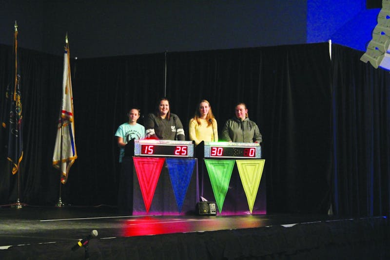 The four finalists of trivia night send up a representative from each team to answer questions for the final lightning round in order to determine a winner.