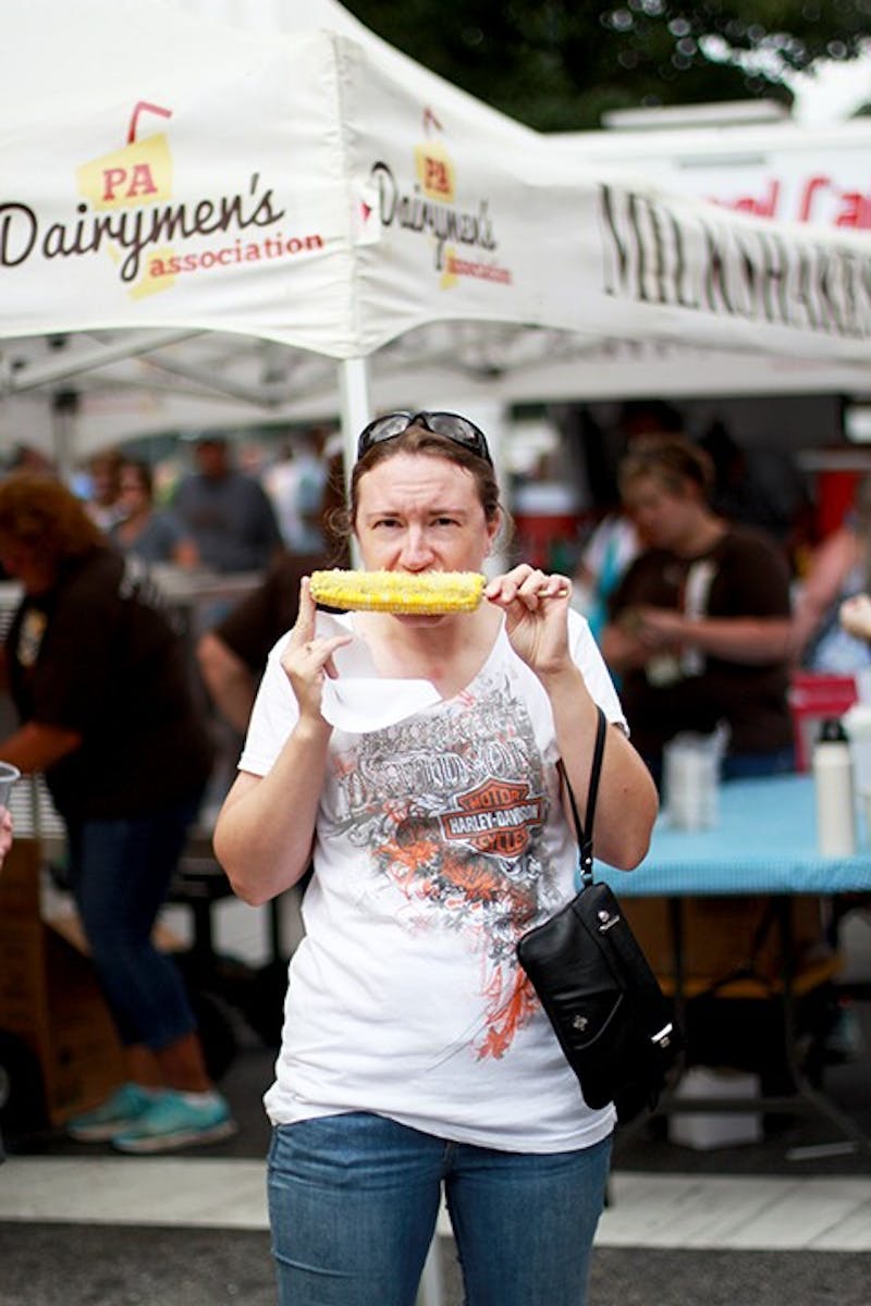 People at the Corn Festival enjoy corn-themed foods such as corn on the cob. There were also other food trucks that served treats such as funnel cake.