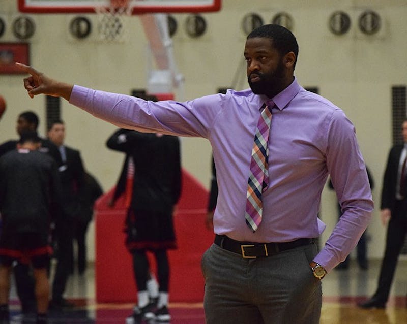 SU men’s basketball assistant coach Chuck Davis instructs players during a pre-game warmup. Davis was a force on the court in his time as a Raider.&nbsp;