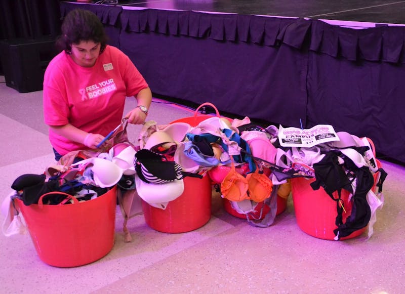 Women's Center graduate assistant Deb Melendez sorts the bra chain.