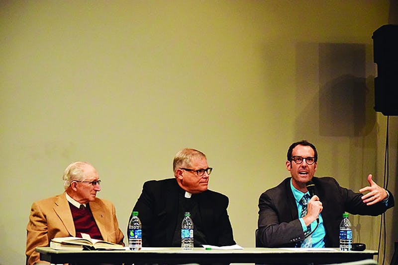 Photo cutline: From left to right, the Rev. Warren Eshbach, the Rev. Mark Oldensburg and colleague Aaron Smith discuss that science and religion are not mutually exclusive. They are faculty members at Lutheran Theological Seminary in Gettysburg.