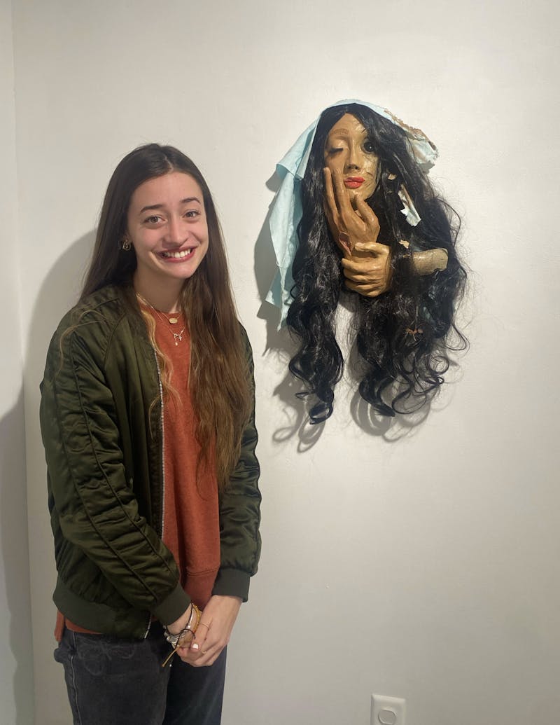 Alyssa Sanders with her ceramic work of art titled, "Mary Magdalene."