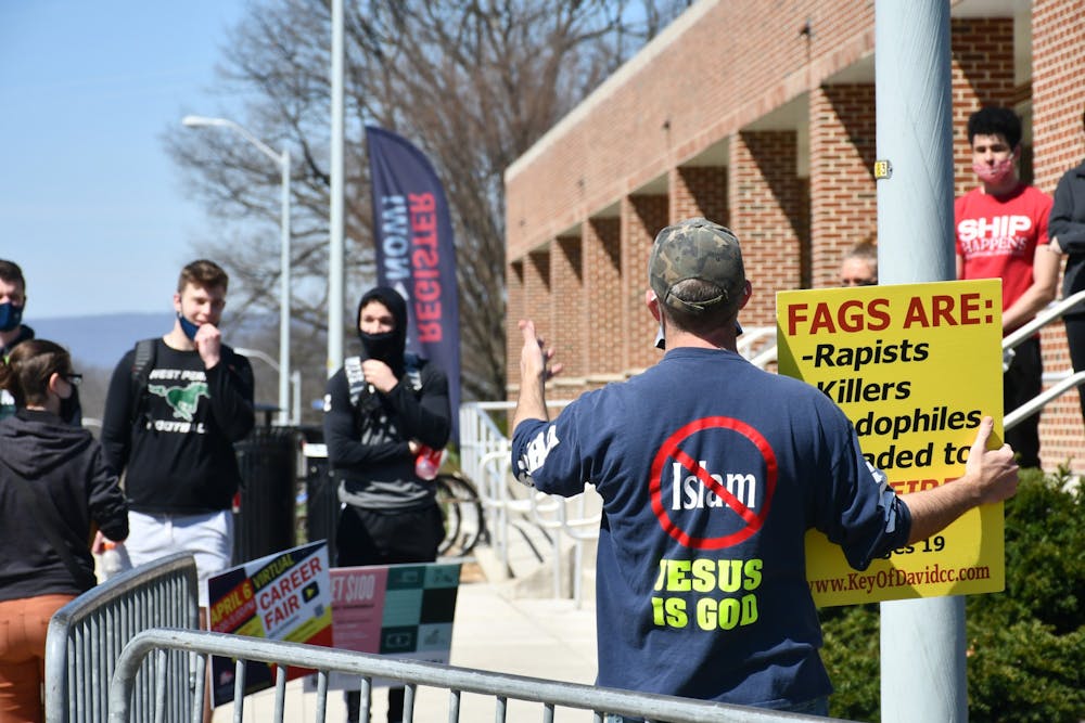Self-described ‘Bible believers’ attract student crowd during demonstration Tuesday