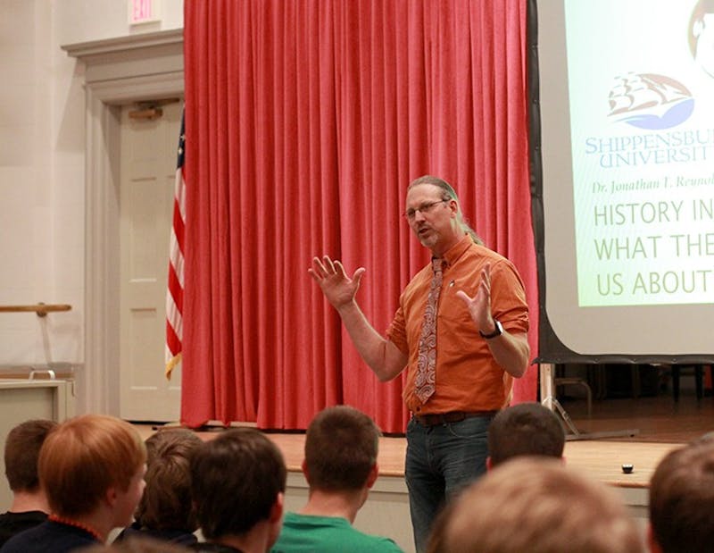 Jonathan Reynolds addresses a large audience in Old Main Chapel about the historical importance of the burrito following a dinner at Reisner Dining Hall.