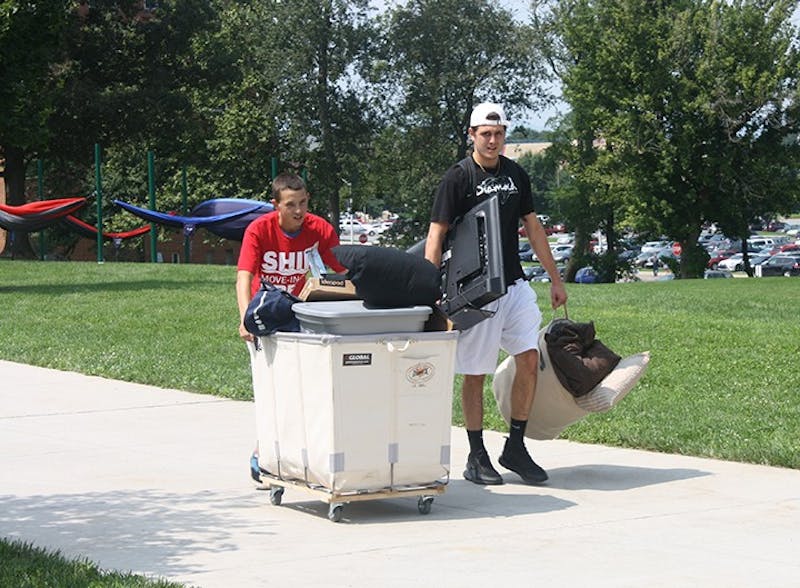 New and returning students use carts to move in items on move-in day. Many student groups such as sports teams, the marching band and the ROTC helped students and their families get settled in their dorms.