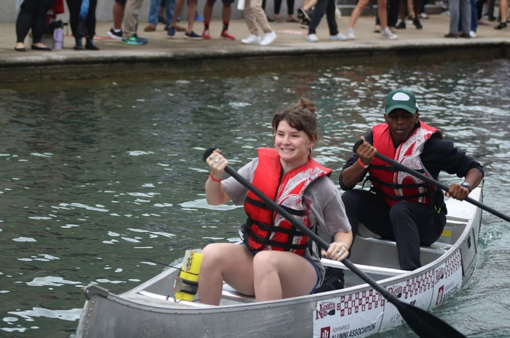 Sophomore Kate Jones (front) and junior Salim Dabougui (back) row during the 16th Annual Regatta