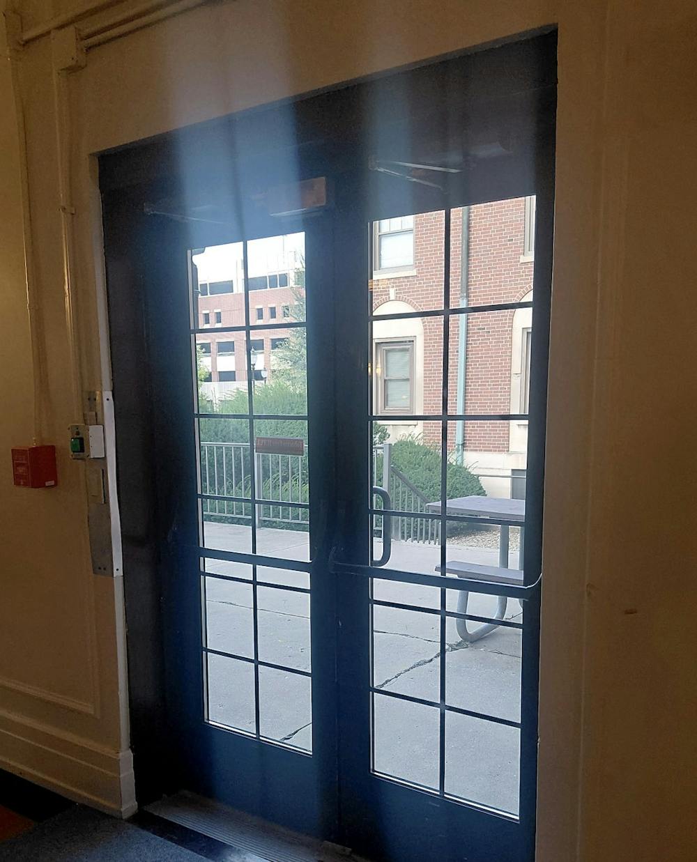 Rear doors leading to a patio at Ball Hall. A resident assistant told first-floor residents Sept. 18 that the building's back doors can be "easily pushed open if not shut right." (Photo courtesy of Caylee Downey)