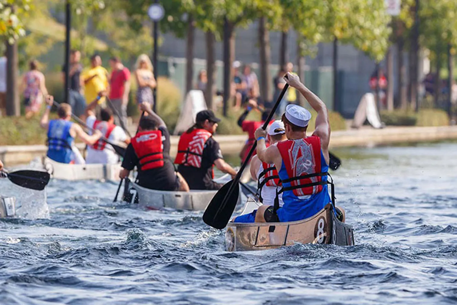 Regatta participants canoe on the canal at Military Park