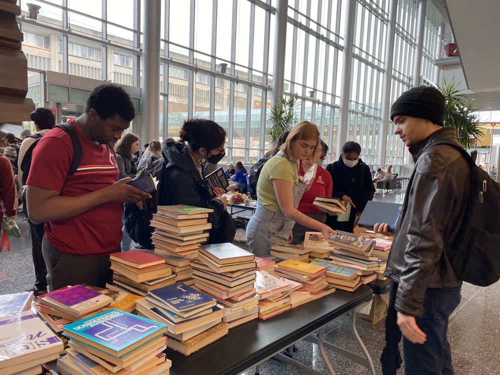 Students look through the piles of books available at the Stuff Swap. Photo courtesy of IUPUI Sustainability.