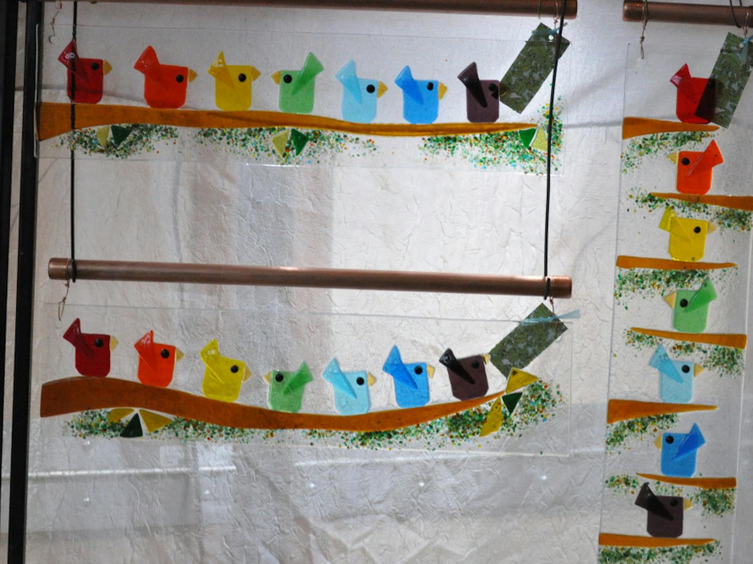 An-example-of-B-Skinners-glasswork-featuring-a-rainbow-of-birds