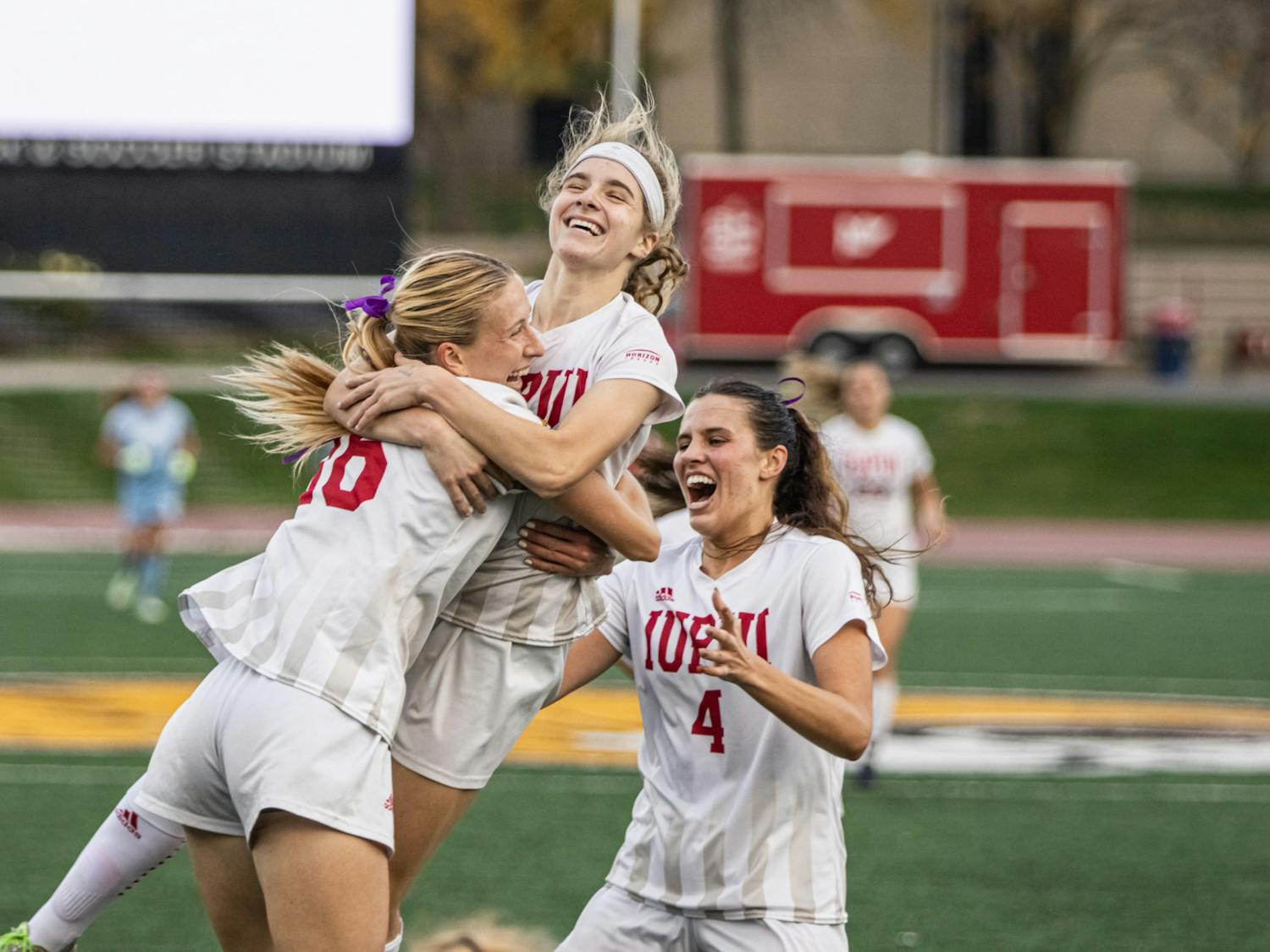 Senior Emma Antoine celebrates with Seniors Sam Slimak and Carlie Werner