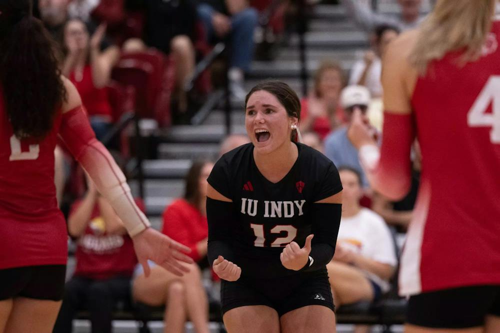 IU Indy's Laura Roeder (12) celebrates a point with teammates during the Jaguars' 3-0 sweep of Butler on Wednesday, Sept. 16, 2026, in the Jungle.