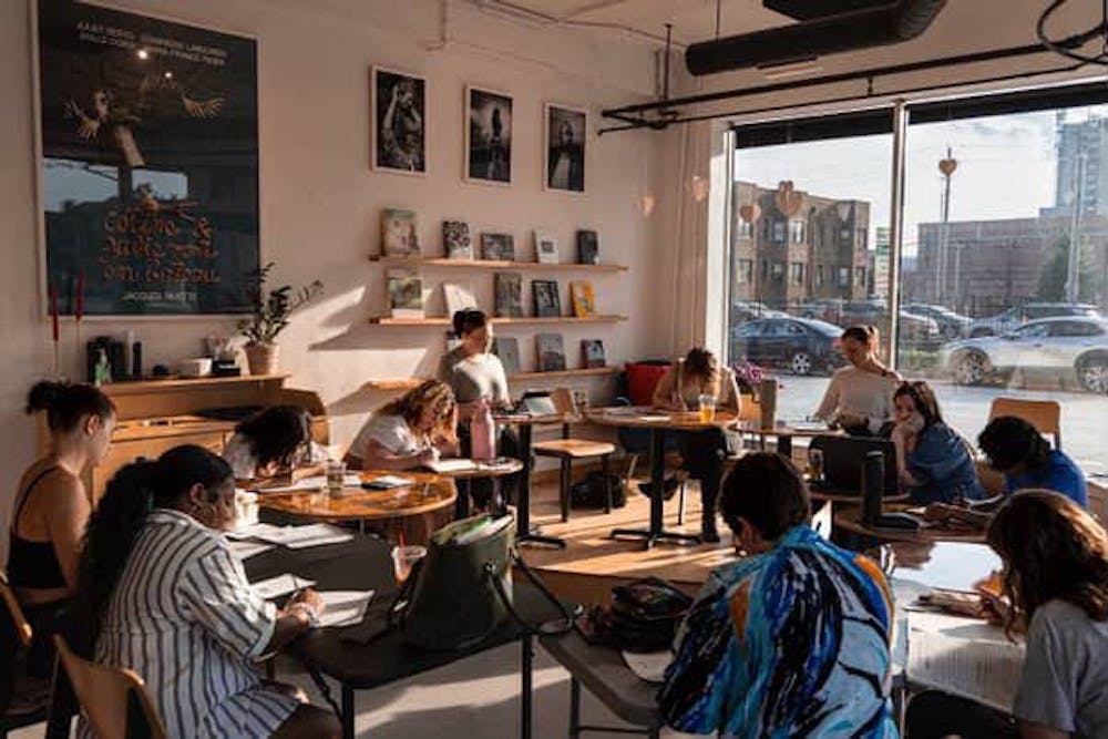 Women gathered at Dream Palace Cafe for a Writings from Her Corner session.
Credits: @lydianortonphotography on Instagram 