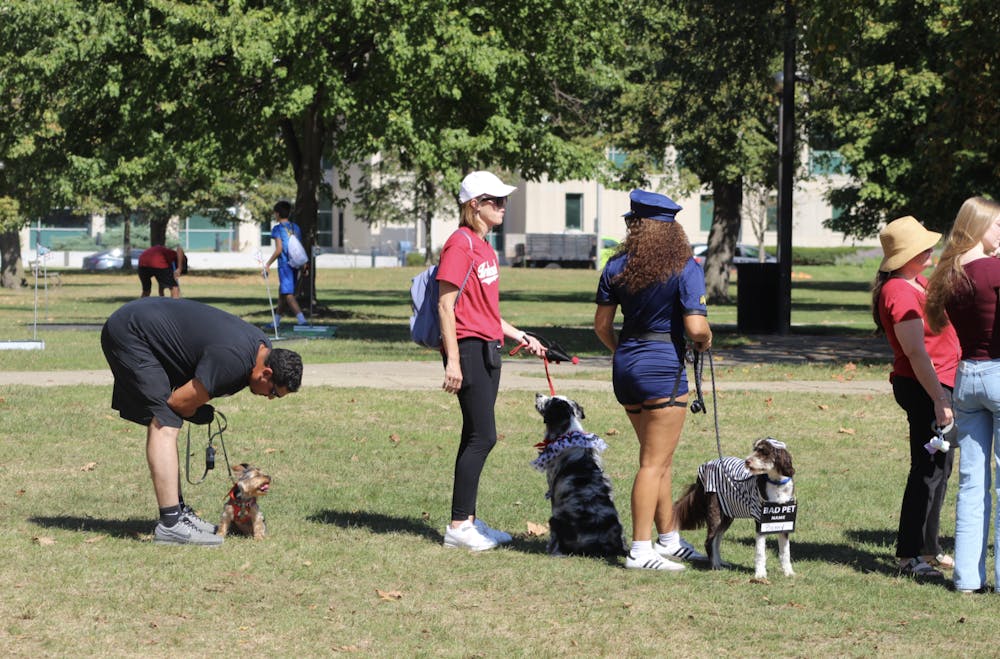 Participants and their dogs line up in costume for the pet parade at IU Indianapolis’ 17th annual Regatta.