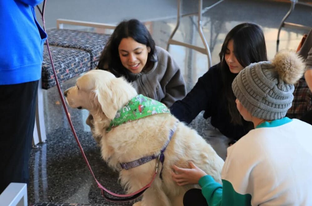 <p>2024 Stress Busters Week event: Students interact with therapy dogs. (Photo Credit: Ryan Anderson)<br/><br/></p>