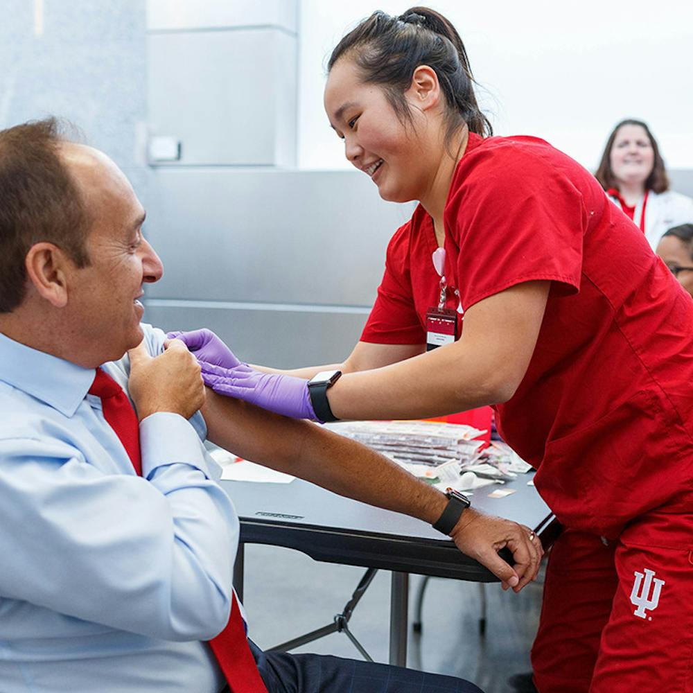 <p>Former Chancellor Paydar receives a vaccine. Photo courtesy of IUPUI Campus Health﻿.</p>