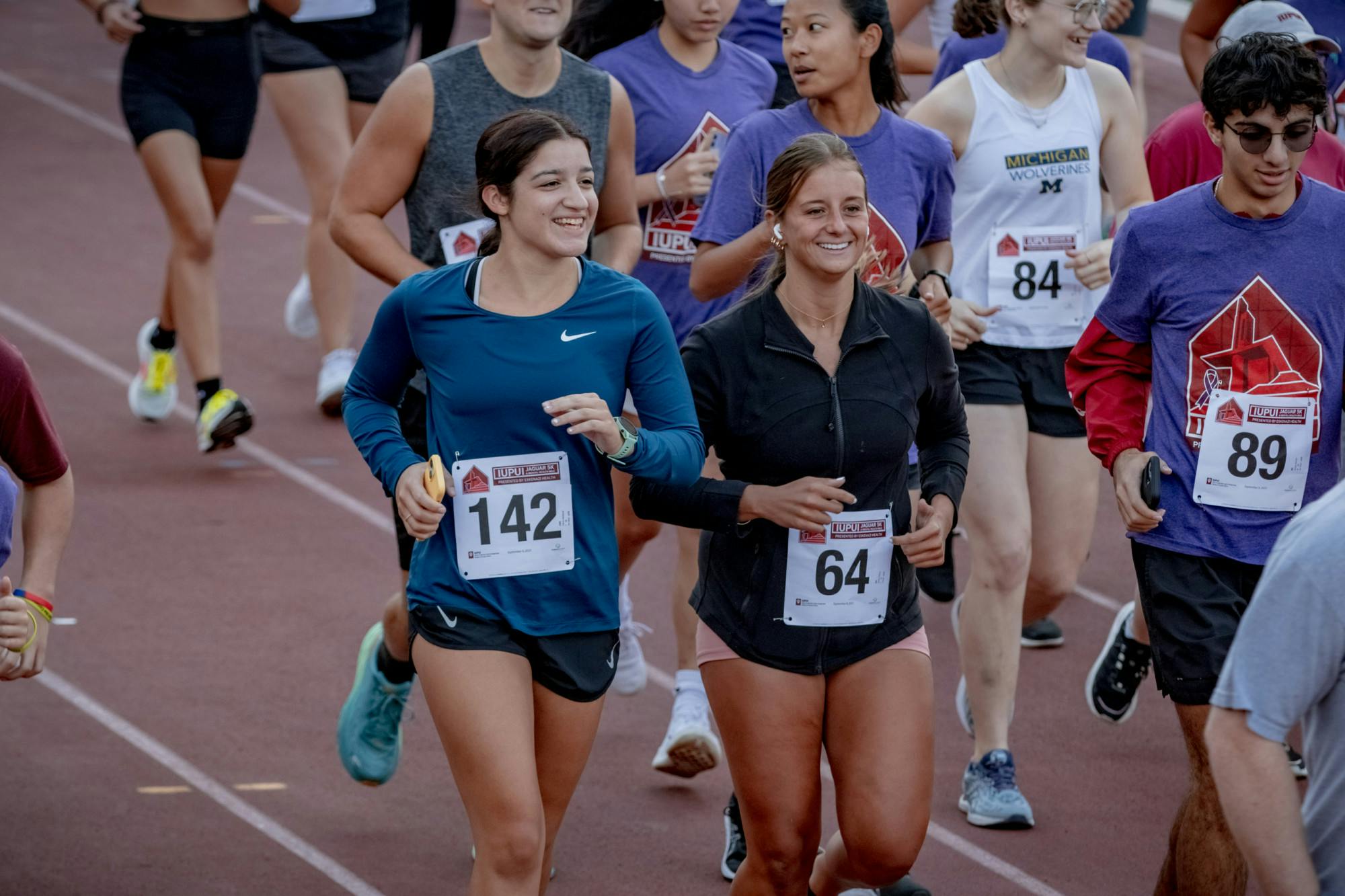 Runners smiles shortly after beginning the 5K