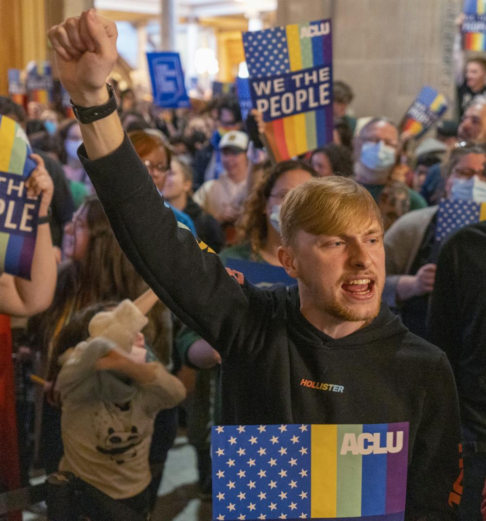 <p>Noah Thomas with about three hundred people at the Indiana Statehouse, Indianapolis, Monday, Feb. 20, 2023, during education committee testimony regarding the so-called “don’t say gay” bill. Photo courtesy of Robert Scheer/IndyStar.</p>