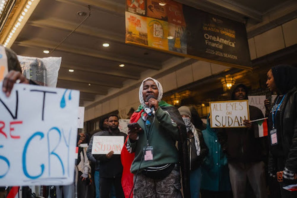 Community members in downtown Indianapolis marching towards Monument Circle, protesting for Sudan. (Photo Courtesy of @laurencolbertmedia on Instagram)