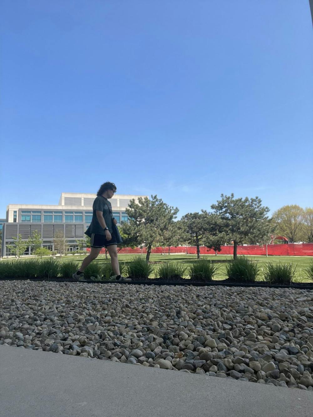 <p>Photo of Claira Brizendine﻿ walking on IUI campus. Photo credit: Claira Brizendine, Photo Courtesy of Mason Einhaus</p>