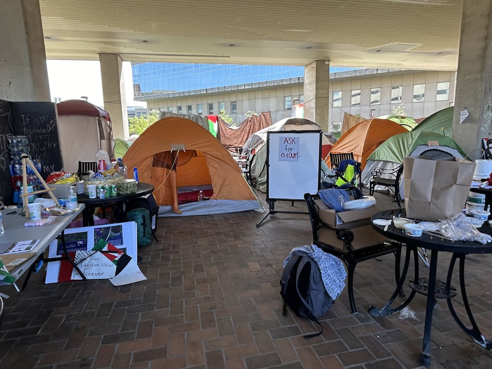 Image of part of the IUPUI student encampment featuring tents named after cities in Palestine prior to the occupation.