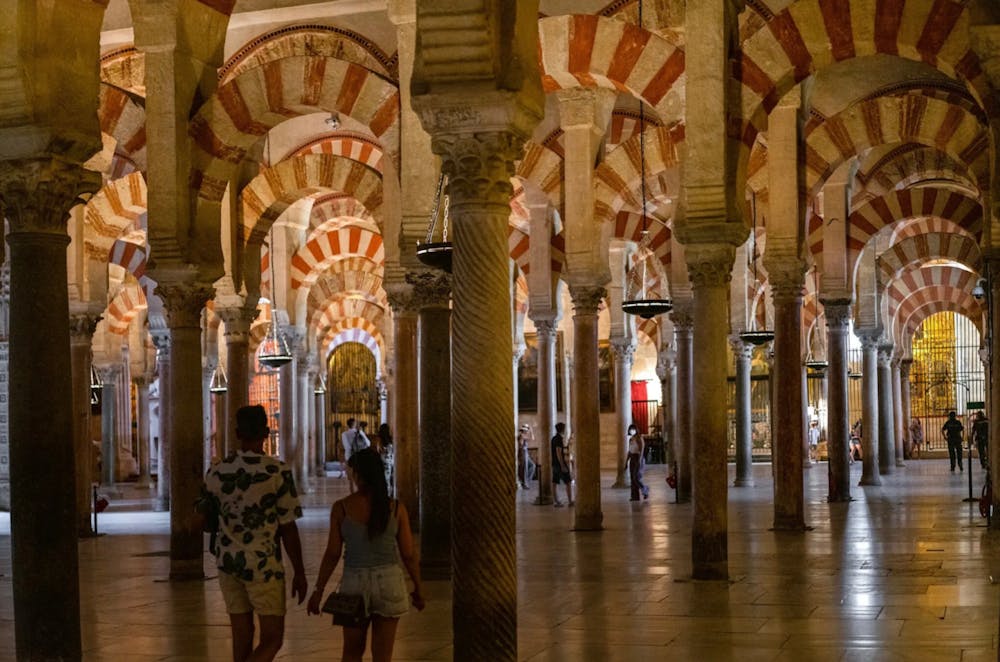 Tourists explore Córdoba’s Mosque-Cathedral in Córdoba, Spain. (Photo courtesy of Emilio Parra Doiztua/The New York Times)