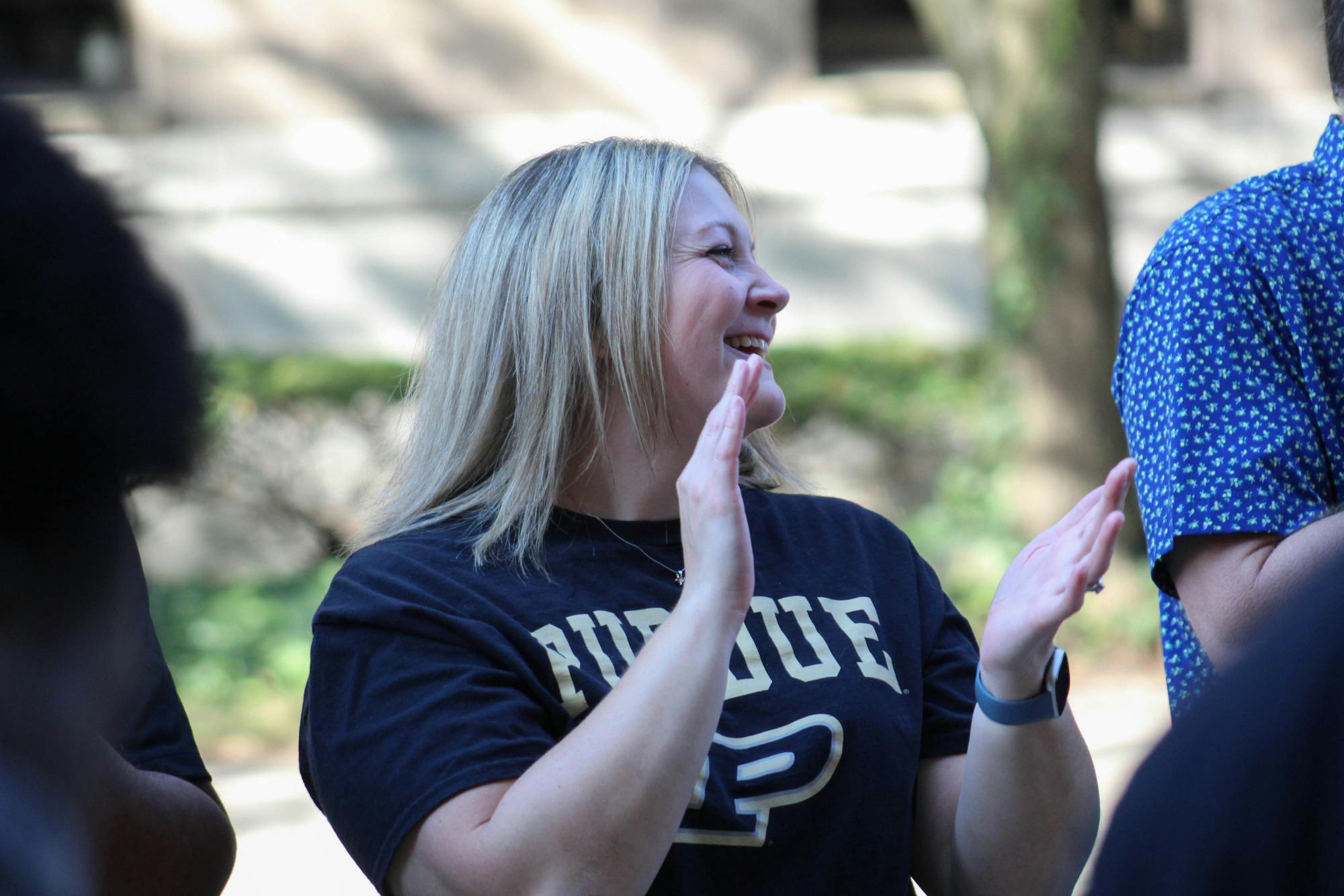 A PUI faculty member smiles at BGR students