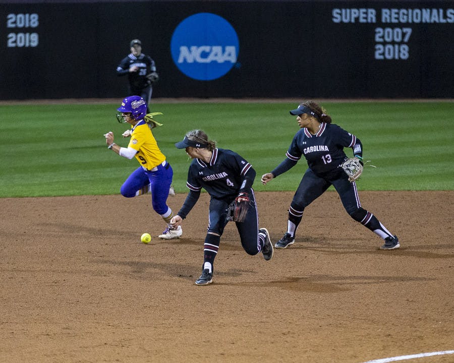LSU sophomore outfielder Madilyn Giglio runs past South Carolina's offense after sophomore infielder Brooke Blankenship makes an error on the play, allowing two RBIs for LSU during the second match of the doubleheader at Beckham Field on March 13, 2023. The Tigers beat the Gamecocks 5-1.