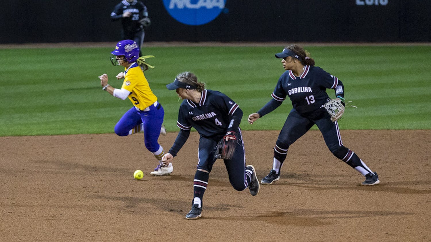 LSU sophomore outfielder Madilyn Giglio runs past South Carolina's offense after sophomore infielder Brooke Blankenship makes an error on the play, allowing two RBIs for LSU during the second match of the doubleheader at Beckham Field on March 13, 2023. The Tigers beat the Gamecocks 5-1.
