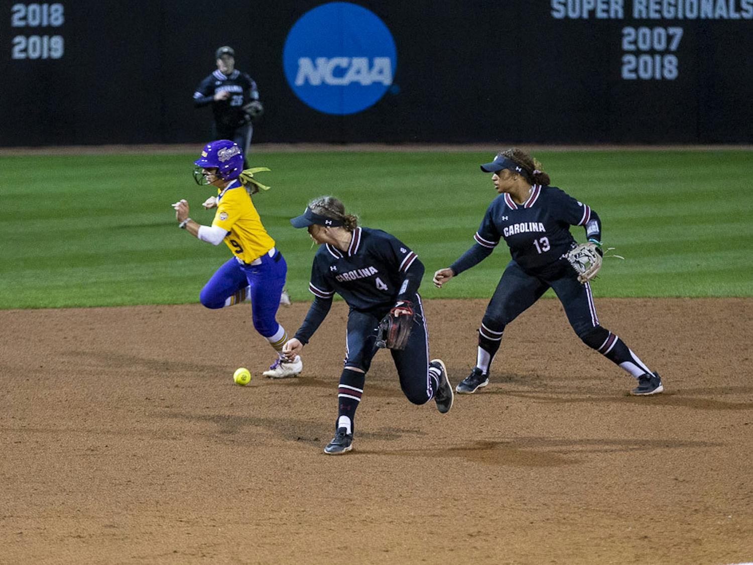 LSU sophomore outfielder Madilyn Giglio runs past South Carolina's offense after sophomore infielder Brooke Blankenship makes an error on the play, allowing two RBIs for LSU during the second match of the doubleheader at Beckham Field on March 13, 2023. The Tigers beat the Gamecocks 5-1.