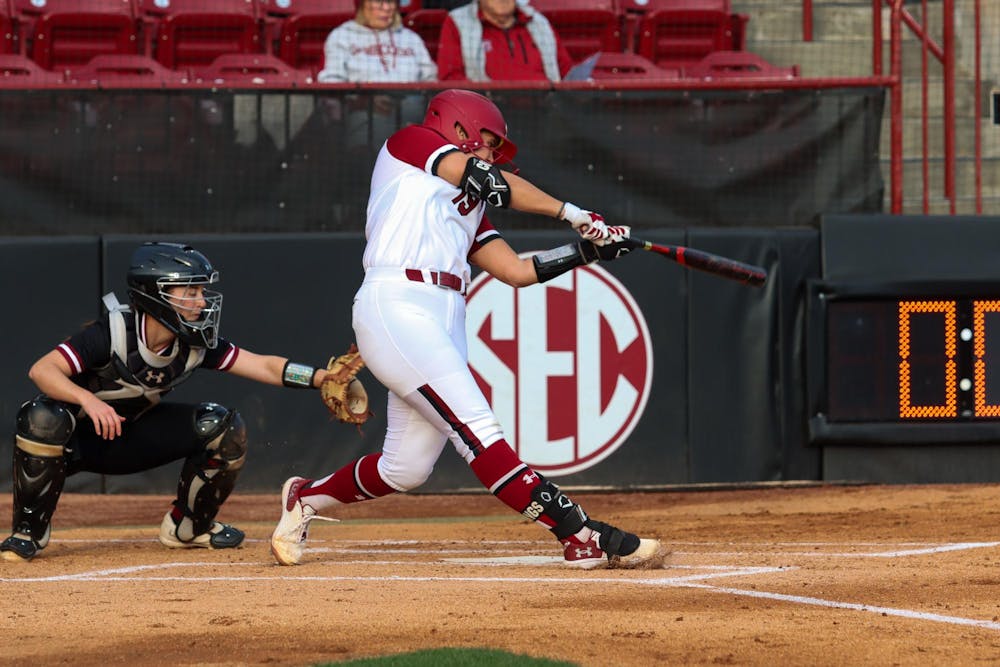 <p>Senior catcher Jen Cummings hits to the outfield during South Carolina's matchup against the College of Charleston on Feb. 28, 2024. Cummings later scored, contributing to the four total runs earned by the Gamecocks in its 4-0 victory.</p>