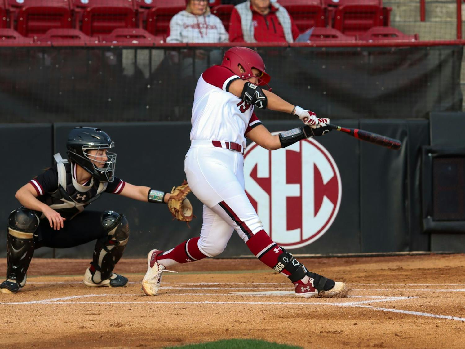 Senior catcher Jen Cummings hits to the outfield during South Carolina's matchup against the College of Charleston on Feb. 28, 2024. Cummings later scored, contributing to the four total runs earned by the Gamecocks in its 4-0 victory.