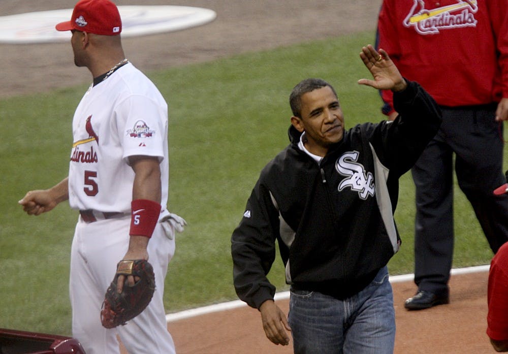President Barack Obama waves to the crowd after throwing out the first pitch during the opening ceremonies for the 2009 Major League Baseball's All-Star game on Tuesday, July 14, 2009, in St. Louis, Missouri. (Zia Nizami/Belleville News-Democrat/MCT)