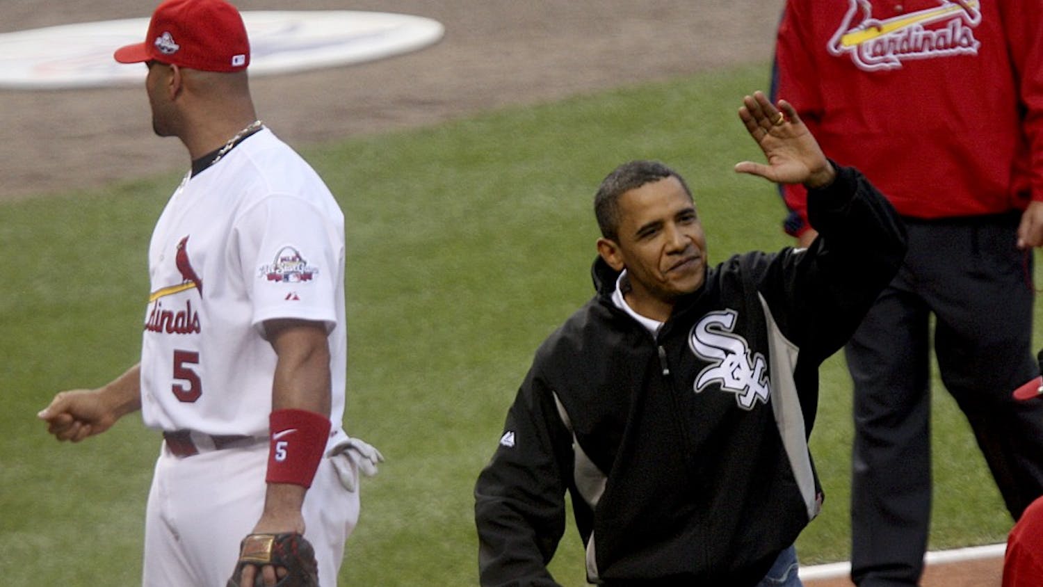 President Barack Obama waves to the crowd after throwing out the first pitch during the opening ceremonies for the 2009 Major League Baseball's All-Star game on Tuesday, July 14, 2009, in St. Louis, Missouri. (Zia Nizami/Belleville News-Democrat/MCT)