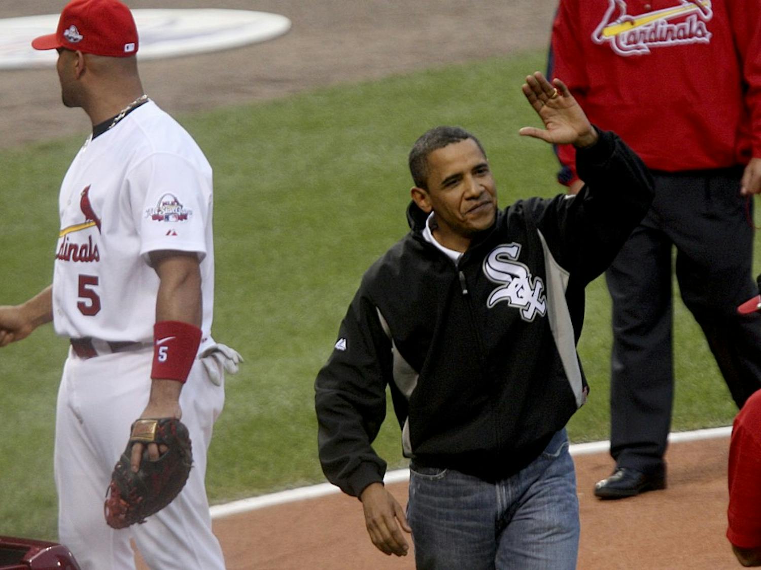 President Barack Obama waves to the crowd after throwing out the first pitch during the opening ceremonies for the 2009 Major League Baseball's All-Star game on Tuesday, July 14, 2009, in St. Louis, Missouri. (Zia Nizami/Belleville News-Democrat/MCT)