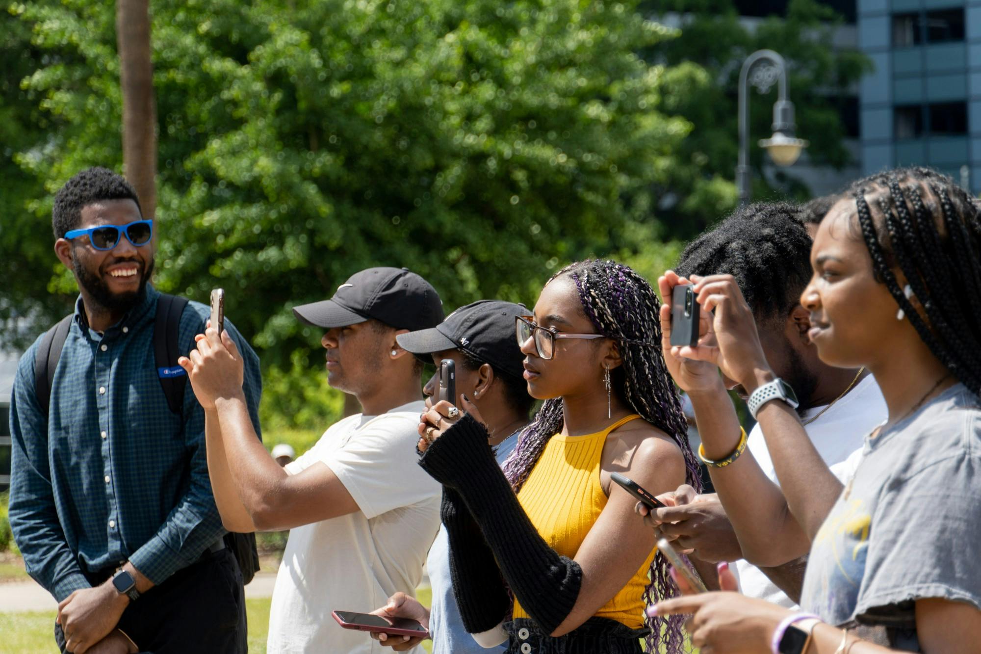 USC students take pictures as Courtney McClain gives a speech on April 23, 2022. Her speech focused around documenting the conviction and imprisonment of Richard Moore and denouncing the death penalty. 