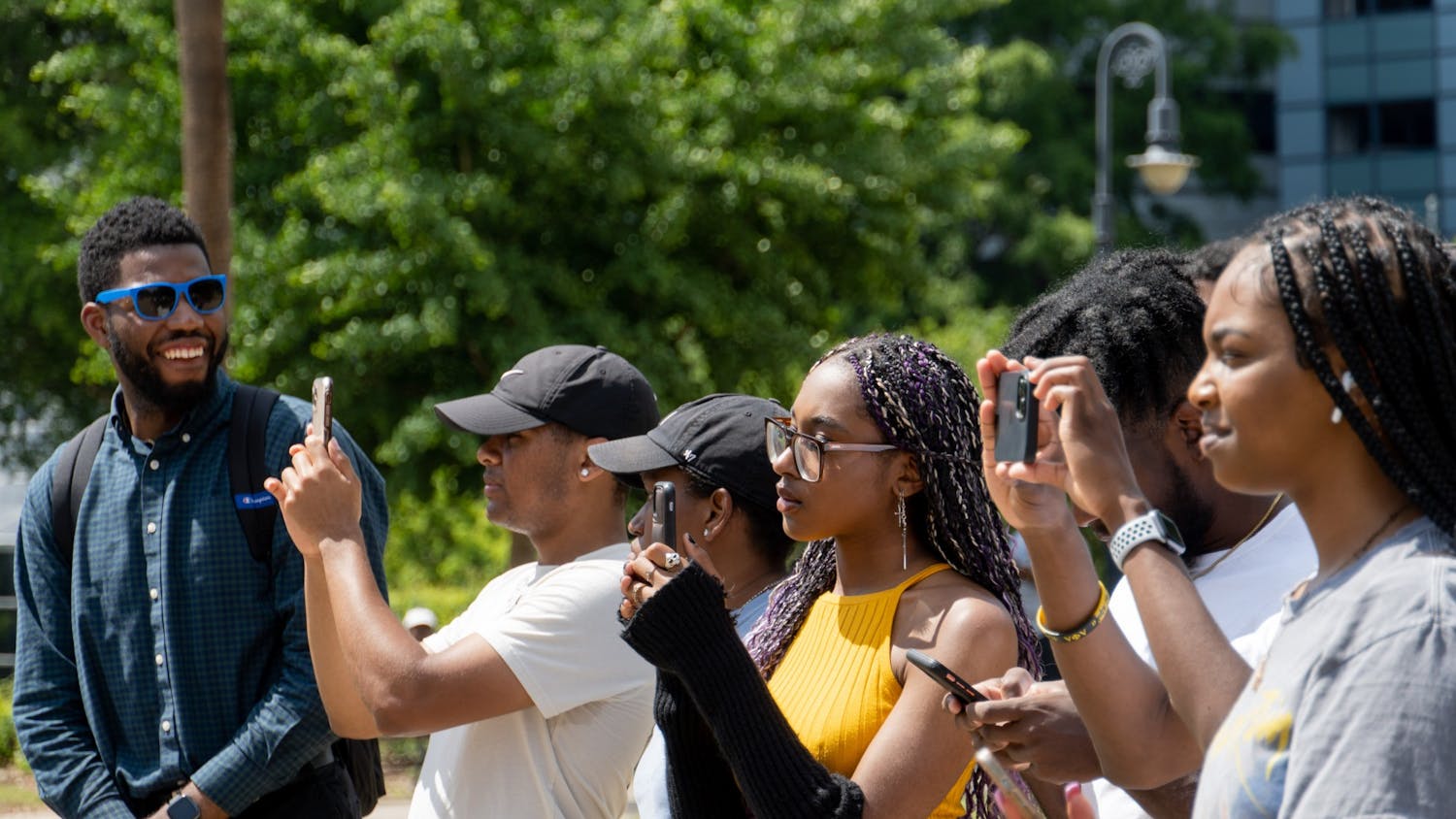 USC students take pictures as Courtney McClain gives a speech on April 23, 2022. Her speech focused around documenting the conviction and imprisonment of Richard Moore and denouncing the death penalty. 