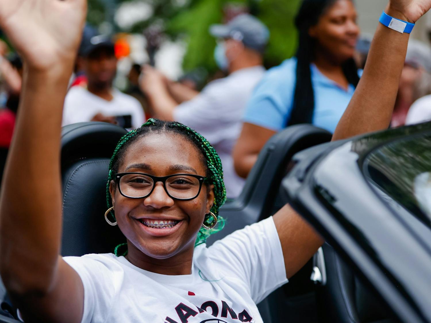 Junior forward Aliyah Boston waves from a car during a parade in honor of the Women’s Basketball team on April 13, 2022. 