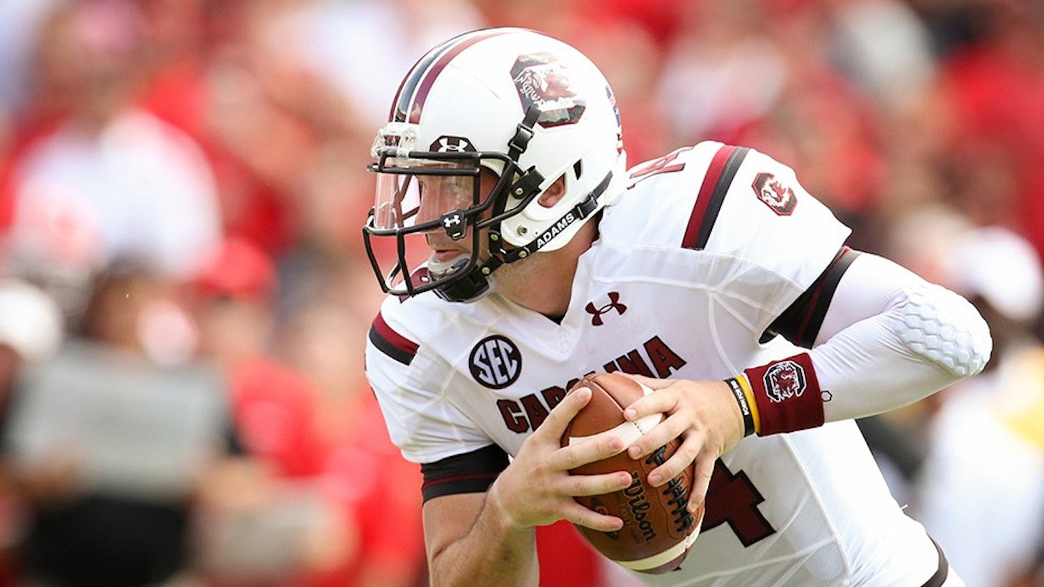 Connor Shaw, the starting quarterback from 2010 to 2013, carrying the ball down the field. Shaw is the winningest quarterback in school history and is one of the 10 new members being added to the South Carolina Athletics Hall of Fame in October.