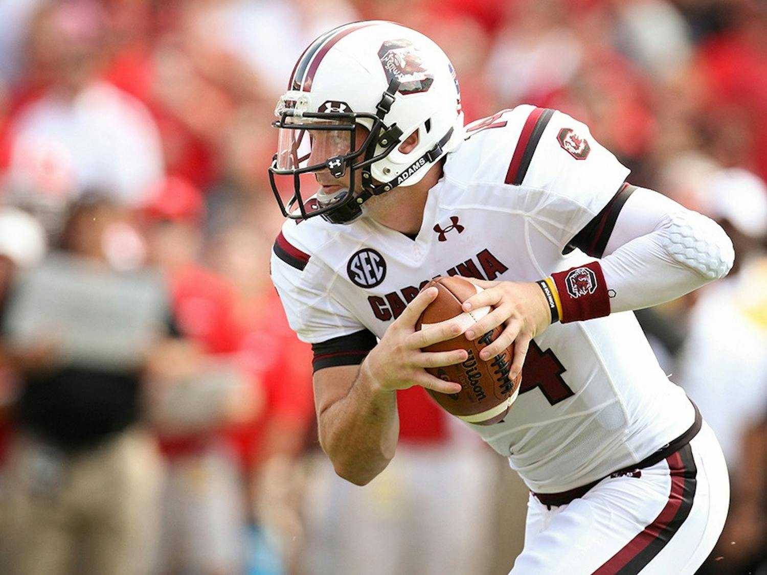 Connor Shaw, the starting quarterback from 2010 to 2013, carrying the ball down the field. Shaw is the winningest quarterback in school history and is one of the 10 new members being added to the South Carolina Athletics Hall of Fame in October.