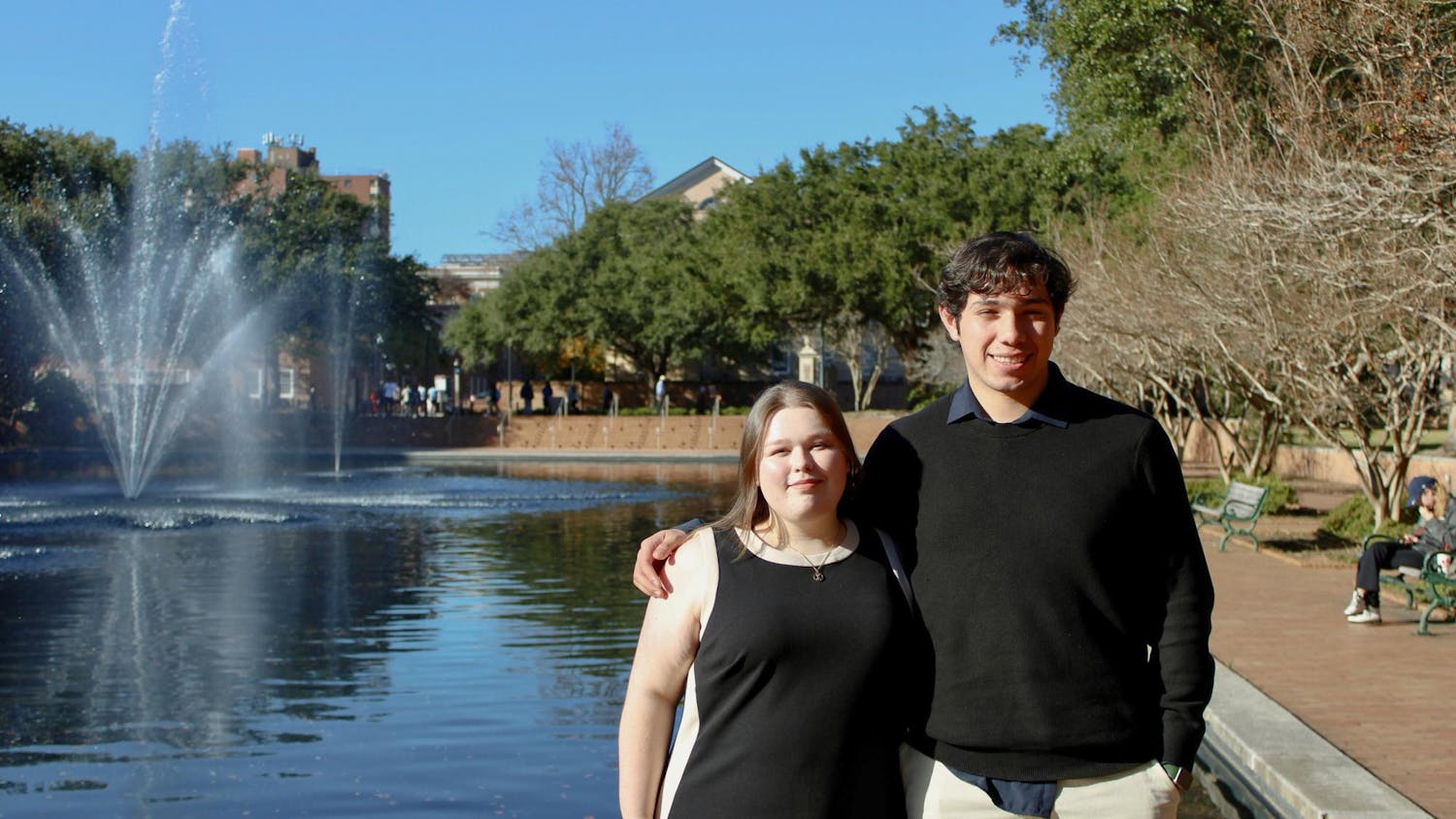 Fourth-year finance student Eleanor McMakin and third-year economics student Dan Contreras pose in front of the Thomas Cooper water fountain on Nov. 14, 2025. McMakin and Contreras got the chance to be chosen as Navigators by the United Nations Research Institute for Social Development and will be able to travel around the world.