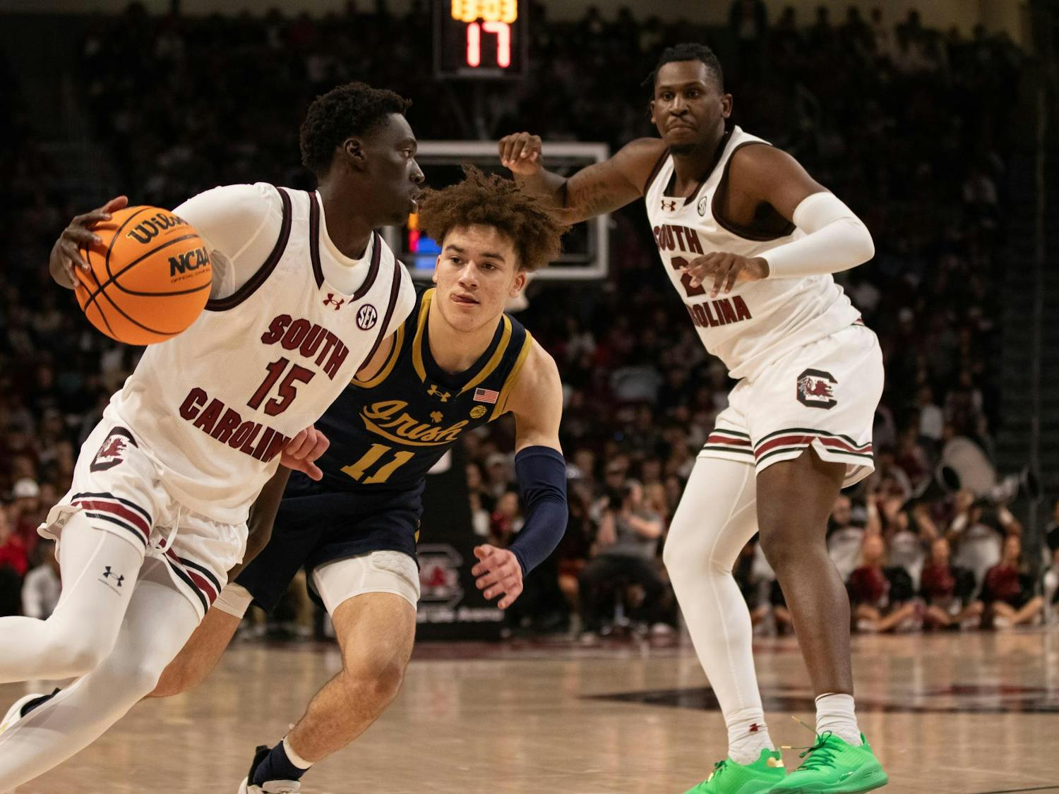 Freshman guard Morris Ugusuk drives the baseline before making a pass to graduate forward B.J. Mack during their game against Notre Dame on Nov. 28, 2023. Ugusuk played 12 minutes in the Gamecocks' 65-53 win but did not score any points.