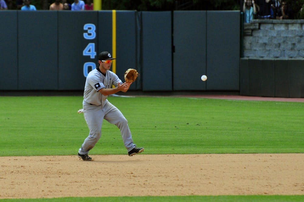 Schrock catches a ground ball.