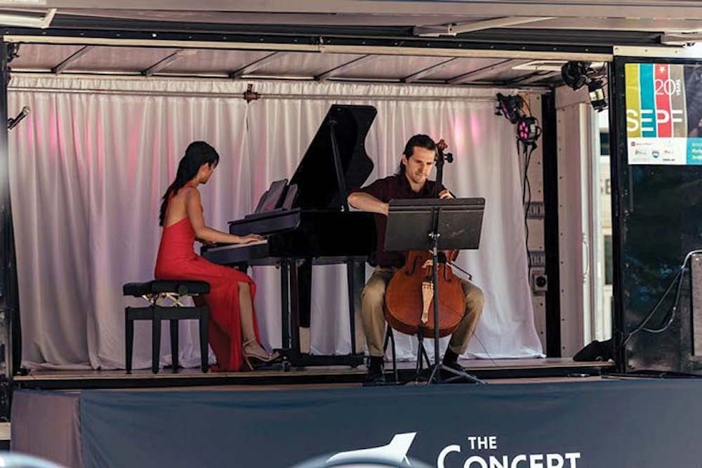 Susan Zhang and Nick Luby perform on the Concert Truck during the Southeastern Piano Festival. Zhang and Luby co-founded the Concert Truck in 2016, converting a 16-foot box truck into a portable stage. 
