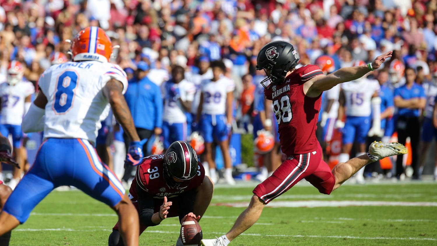 Senior placekicker Mitch Jeter kicks a ball held by senior punter Kai Kroeger after a touchdown during South Carolina’s 41-39 loss to Florida on Oct. 14, 2023 at Williams-Brice Stadium. The Gamecocks finished the 2023 season with a record of 5-7.